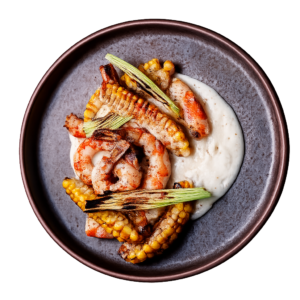 Corn ribs y langostinos grillados